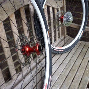 White Stans Crest rims on red Hope Pro2 hubs